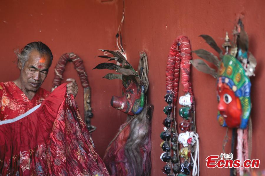 People in traditional costumes celebrate the Shikali festival in Patan, Nepal, Oct. 15, 2018. The festival is observed by people from the ethnic Newar community. During the festival, people wear masks representing different Hindu gods and goddesses, and dance and pray for happiness. (Photo/China News Service)