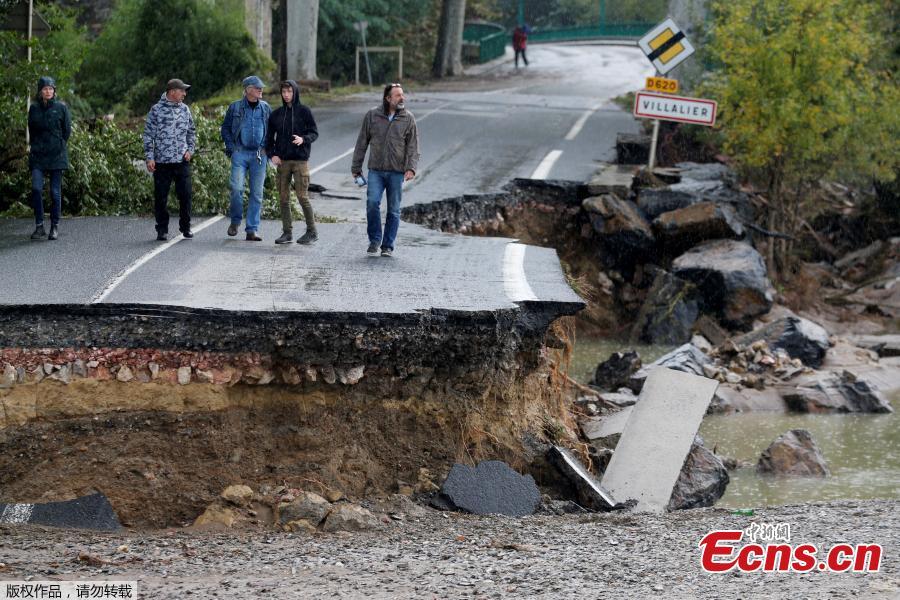 A road partially washed away after flash floods hit the southwestern Aude district of France after several months\' worth of rain fell in just a few hours overnight, in Conques, France, Oct. 16, 2018. At least 12 people died. (Photo/Agencies)
