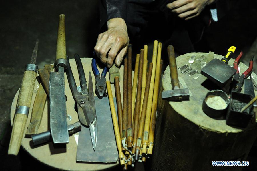 Tools for making Lusheng are seen at Jinying Village in Congjiang County of Miao and Dong Autonomous Prefecture of Qiandongnan, southwest China\'s Guizhou Province, on Oct. 16, 2018. Lusheng is an ethnic musical instrument with multiple bamboo pipes set into a wooden blowing tube. It is popular among the people of some ethnic groups living in southwestern China. Jinying Village, known for making Lusheng, still keeps the traditional Lusheng making techniques which include over 30 steps such as choosing material, installing reed and whittling sound hole. People often play the Lusheng while gathering to celebrate some major festivals. (Xinhua/Yang Wenbin)
