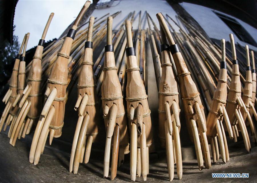 Finished Lushengs are seen at Jinying Village in Congjiang County of Miao and Dong Autonomous Prefecture of Qiandongnan, southwest China\'s Guizhou Province, on Oct. 16, 2018. Lusheng is an ethnic musical instrument with multiple bamboo pipes set into a wooden blowing tube. It is popular among the people of some ethnic groups living in southwestern China. Jinying Village, known for making Lusheng, still keeps the traditional Lusheng making techniques which include over 30 steps such as choosing material, installing reed and whittling sound hole. People often play the Lusheng while gathering to celebrate some major festivals. (Xinhua/Chen Yehua)