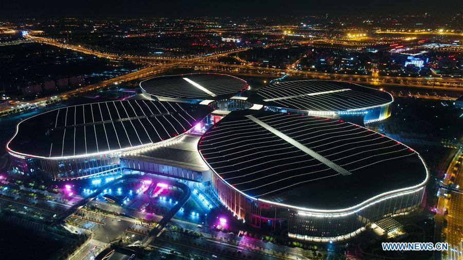 Photo taken on Oct. 21, 2018 shows a night view of the National Exhibition and Convention Center (Shanghai) in Shanghai, east China. The six-day China International Import Expo (CIIE) will be opened in the center on Nov. 5. (Xinhua/Ding Ting)