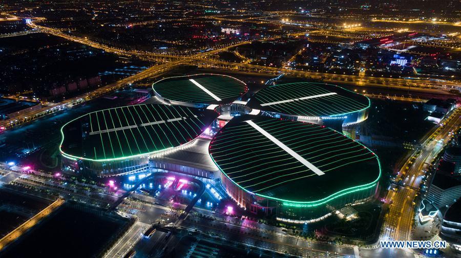 Photo taken on Oct. 21, 2018 shows a night view of the National Exhibition and Convention Center (Shanghai) in Shanghai, east China. The six-day China International Import Expo (CIIE) will be opened in the center on Nov. 5. (Xinhua/Ding Ting)