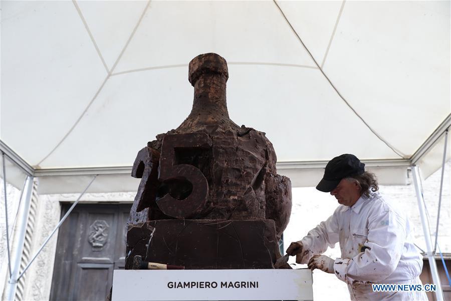 An artist sculpts chocolate during the 25th international chocolate festival \