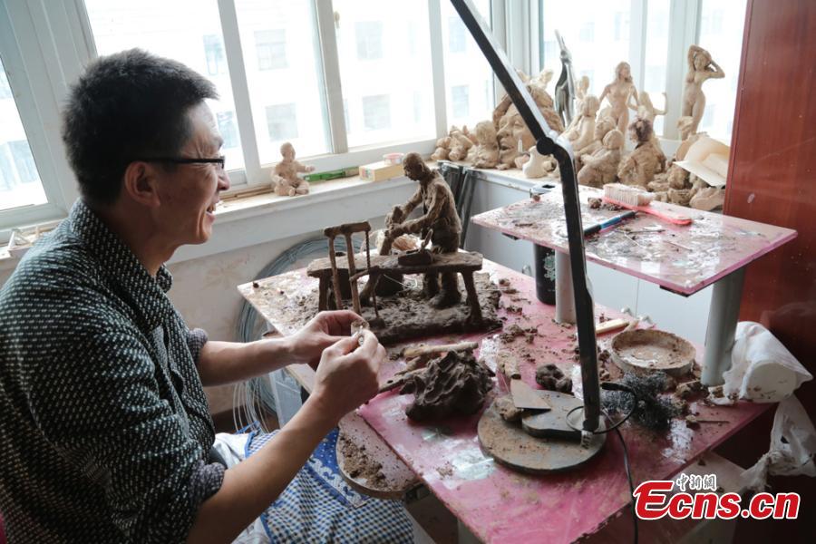 Clay sculpture enthusiast Zhao Tiejun gives the final touch on creations featuring past rural life and farming traditions in his home in Pingliang City, Northwest China’s Gansu Province, Oct. 23, 2018. Zhao has been fascinated with the hobby of making clay figurines for two decades as he believes the handicraft can help younger generation learn about the countryside life now increasingly transformed. (Photo: China News Service/Zheng Bing)