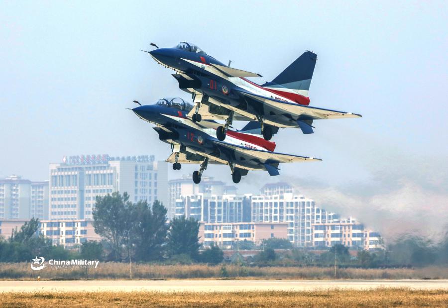 Two J-10 fighter jets attached to the August 1st Aerobatics Team of the Chinese People\'s Liberation Army (PLA) Air Force take off during the aviation open day at an airport in North China on October 20, 2018. (Photo/eng.chinamil.com.cn)