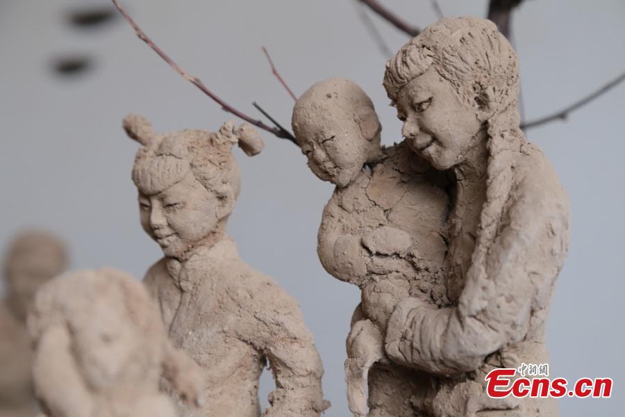 Clay sculpture enthusiast Zhao Tiejun shows his creations featuring past rural life and farming traditions in his home in Pingliang City, Northwest China’s Gansu Province, Oct. 23, 2018. Zhao has been fascinated with the hobby of making clay figurines for two decades as he believes the handicraft can help younger generation learn about the countryside life now increasingly transformed. (Photo: China News Service/Zheng Bing)