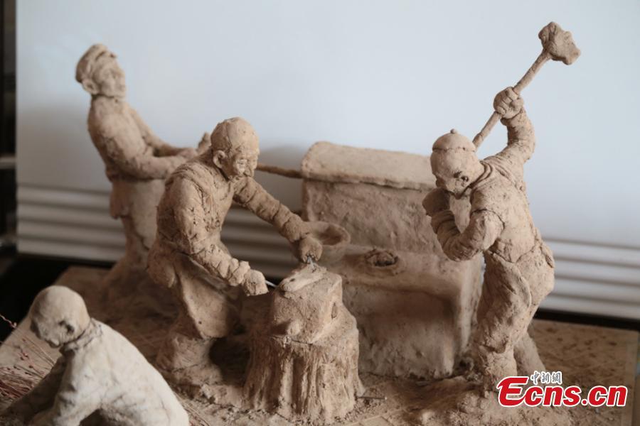 Clay sculpture enthusiast Zhao Tiejun shows his creations featuring past rural life and farming traditions in his home in Pingliang City, Northwest China’s Gansu Province, Oct. 23, 2018. Zhao has been fascinated with the hobby of making clay figurines for two decades as he believes the handicraft can help younger generation learn about the countryside life now increasingly transformed. (Photo: China News Service/Zheng Bing)