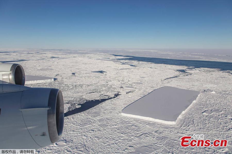 Photo by NASA shows a rectangular iceberg spotted off the east coast of the Antarctic Peninsula, near the Larsen C ice shelf. NASA experts say the sharp angles and flat surfaces are evidence the break occurred very recently. (Photo/NASA)