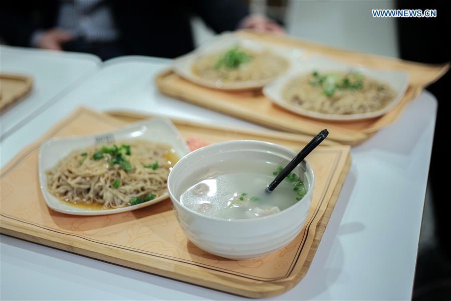 Shaxian Wonton and noddles with peanut sauce, which are signature dishes of Shaxian Snacks, are seen in the Shaxian Snacks restaurant in Brooklyn, New York, the United States, on Oct. 21, 2018. China\'s restaurant chain serving Shaxian County cuisine has opened its first eatery in the United States. Located at 818, 60th St. Brooklyn, the restaurant, which opened Monday, presents overseas foodies with traditional Chinese snacks, including peanut butter noodles and pork wontons. (Xinhua/Li Muzi)