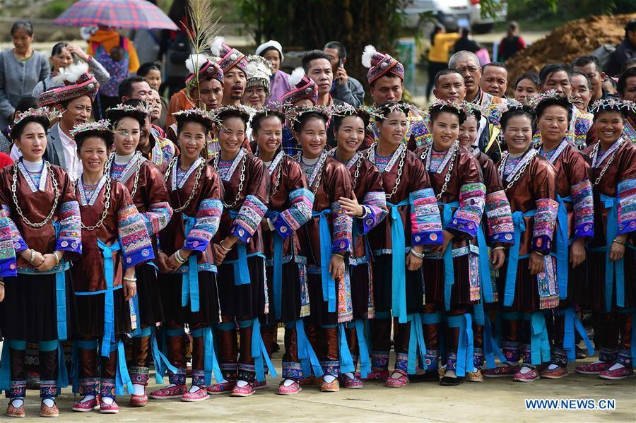 People of Dong ethnic group view performances during a harvest festival in Dongtou Village, Rongshui Miao Autonomous County, south China\'s Guangxi Zhuang Autonomous Region, Oct. 26, 2018. Local people celebrated harvest Friday through various activities like fish feast, singing and playing lusheng. (Xinhua/Huang Xiaobang)