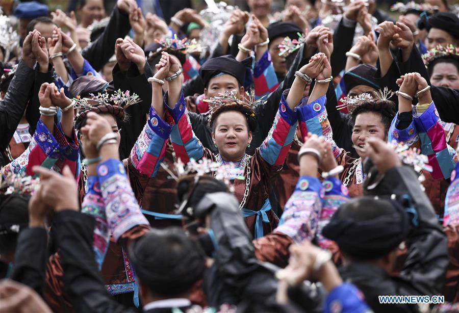 People dance during a harvest festival in Dongtou Village, Rongshui Miao Autonomous County, south China\'s Guangxi Zhuang Autonomous Region, Oct. 26, 2018. Local people celebrated harvest Friday through various activities like fish feast, singing and playing lusheng. (Xinhua/Lan Hongguang)