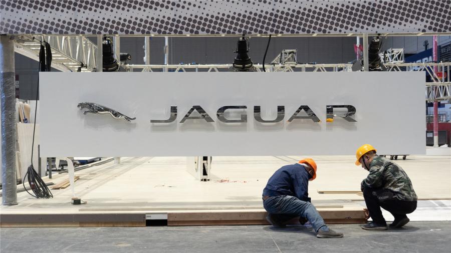 Two employees work on the exhibition booth for Jaguar Land Rover at the National Exhibition and Convention Center (Shanghai) on Oct. 28. The UK automaker will exhibit its first electric SUV I-PACE at the upcoming China International Import Expo.  (Photo/chinadaily.com.cn)

Workers were busy on Oct. 28 preparing the booths for participants of the upcoming China International Import Expo at the National Exhibition and Convention Center (Shanghai). Among those slated to exhibit their latest products and services are Fortune 500 companies including Intel, Samsung, Jaguar and Siemens.
