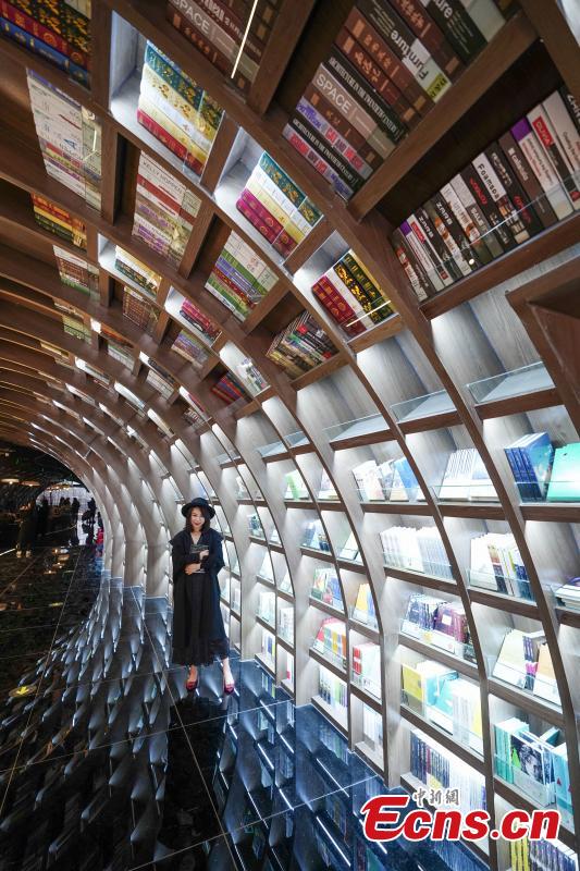 Neatly-arranged books are set on shelves at a new outlet of the Zhongshuge bookstore in Guiyang City, Southwest China’s Guizhou Province, Oct. 29, 2018. The design of the store took inspiration from the karst landforms of the province and features other signature tourism and cultural icons, making it a fresh attraction for local readers and other visitors. (Photo: China News Service/He Junyi)