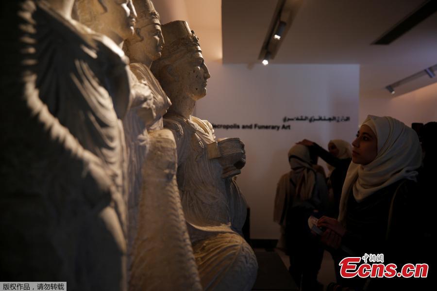 Visitors look at sculptures displayed during the reopening of Syria\'s National Museum of Damascus, Syria October 28, 2018. Syria’s National Museum of Damascus opened its rich trove of antiquities to visitors again on October 28, over six years after war forced them to close and months after the government recaptured all rebel areas near the capital. (Photo/Agencies)