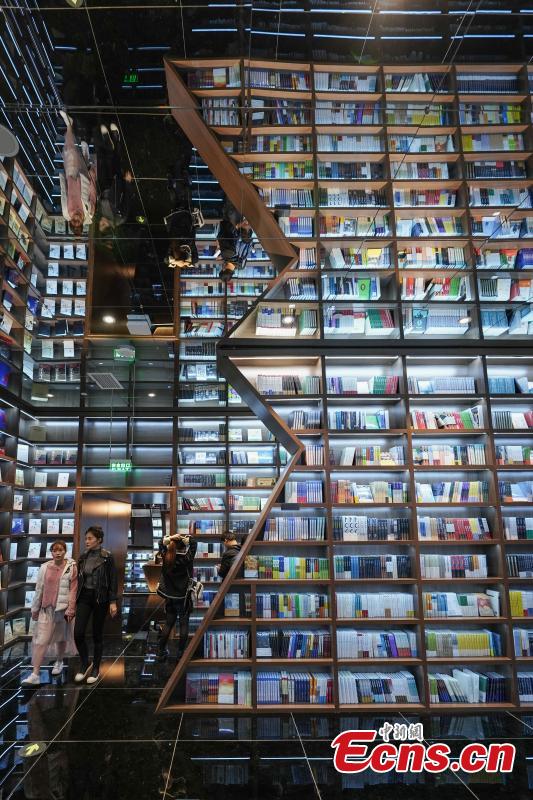 Neatly-arranged books are set on shelves at a new outlet of the Zhongshuge bookstore in Guiyang City, Southwest China’s Guizhou Province, Oct. 29, 2018. The design of the store took inspiration from the karst landforms of the province and features other signature tourism and cultural icons, making it a fresh attraction for local readers and other visitors. (Photo: China News Service/He Junyi)