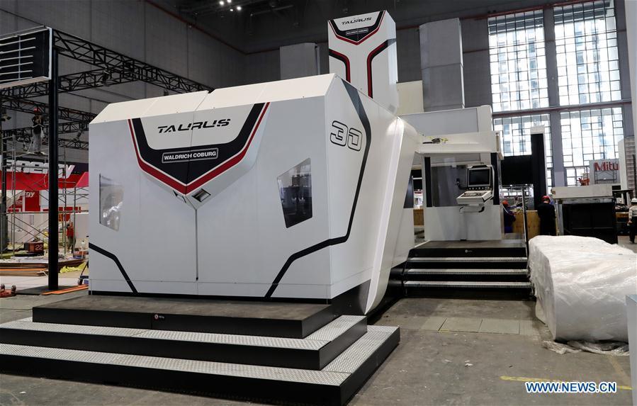 A Taurus milling machine from German Waldrich Coburg is adjusted at an exhibition hall in the National Exhibition and Convention Center (Shanghai) in Shanghai, east China, on Oct. 30, 2018. The final work is underway to get all eight exhibition halls ready for the first China International Import Expo (CIIE), scheduled to be held from Nov. 5 to 10. (Xinhua/Fang Zhe)