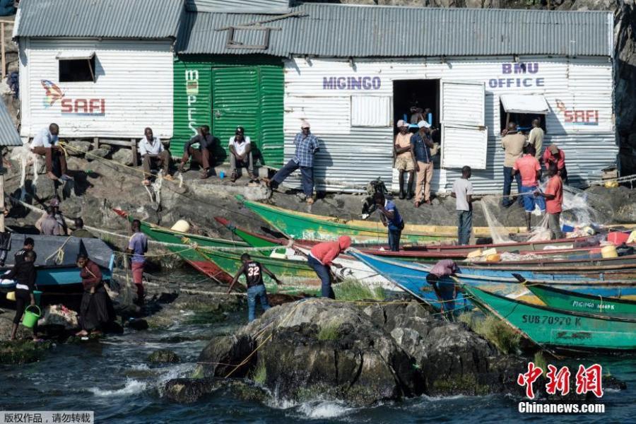 A picture taken on October 5, 2018, shows a general view of Migingo island which is densely populated by residents fishing mainly for Nile perch in Lake Victoria on the border of Uganda and Kenya. A rounded rocky outcrop covered in metallic shacks, Migingo Island rises out of the waters of Lake Victoria like an iron-plated turtle. The densely-populated island is barely a quarter of a hectare large, its residents crammed into a hodge-podge of corrugated-iron homes, with seemingly little but a few bars, brothels and a tiny port to boast of. (Photo/Agencies)