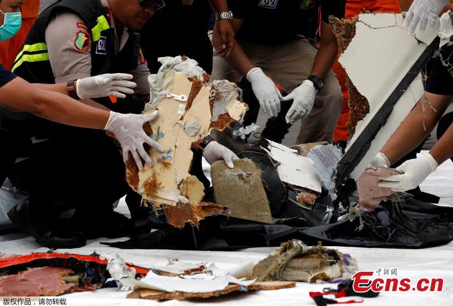 Rescue workers lay out newly recovered debris of Lion Air flight JT610 at Tanjung Priok port in Jakarta, Indonesia, Oct. 30, 2018.  The search continued Tuesday for bodies and the \