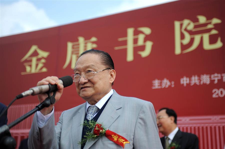 In this file photo, Jin Yong addresses the groundbreaking ceremony of an academy named after him in Haining, east China\'s Zhejiang Province, on Sept. 17, 2008. Famous Chinese martial arts novelist Louis Cha Leung-yung, more widely known by his pen name Jin Yong, died at 94 at a hospital in Hong Kong on Tuesday. Cha created many widespread martial arts novels between 1955 and 1972. Cha, who also co-founded the Hong Kong daily newspaper Ming Pao, has been regarded as one of the greatest and most popular martial arts writers. (Xinhua/Xu Yu)