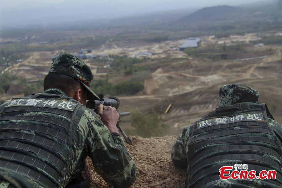 Snipers from a special unit of the Chinese People\'s Armed Police Force sharp their skills during a training at Songshan Mountain, Central China’s Henan province.  (Photo: China News Service/ Zhao Hongtao)