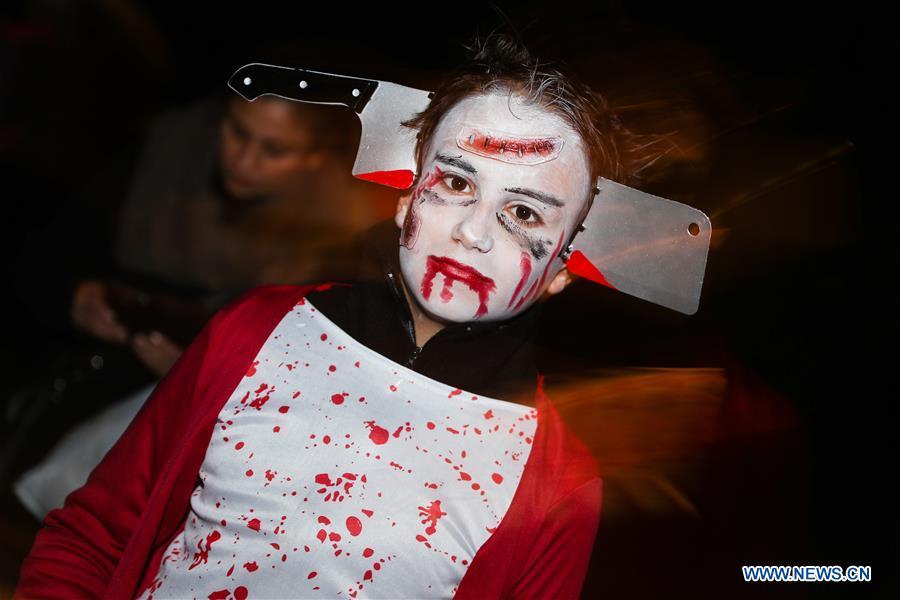 A girl takes part in a Halloween parade in Brussels, Belgium, Oct. 31, 2018. (Xinhua/Zheng Huansong)