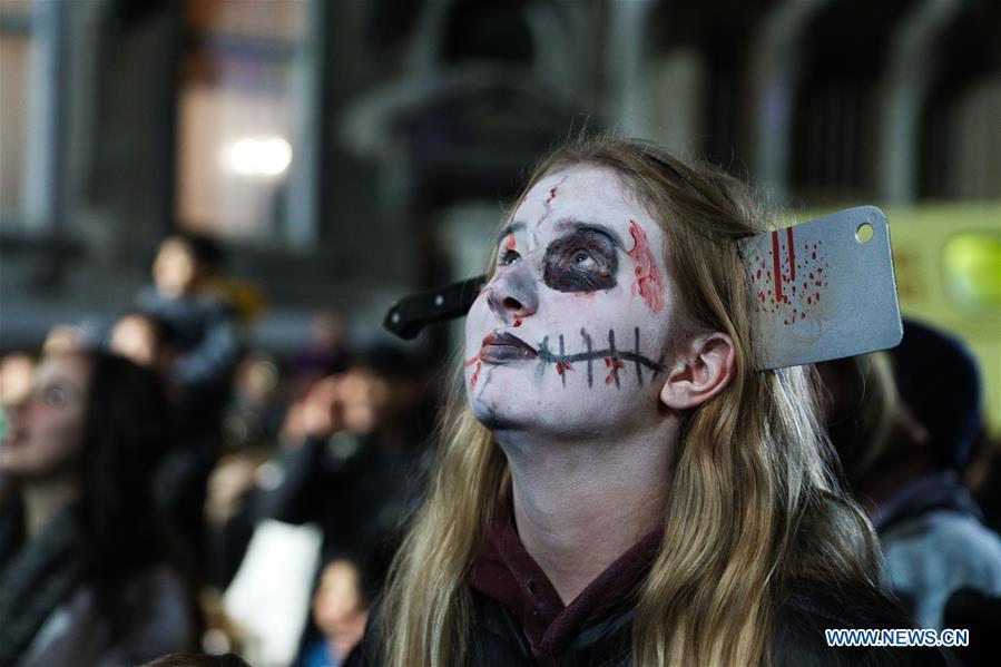 A girl takes part in a Halloween parade in Brussels, Belgium, Oct. 31, 2018. (Xinhua/Zheng Huansong)