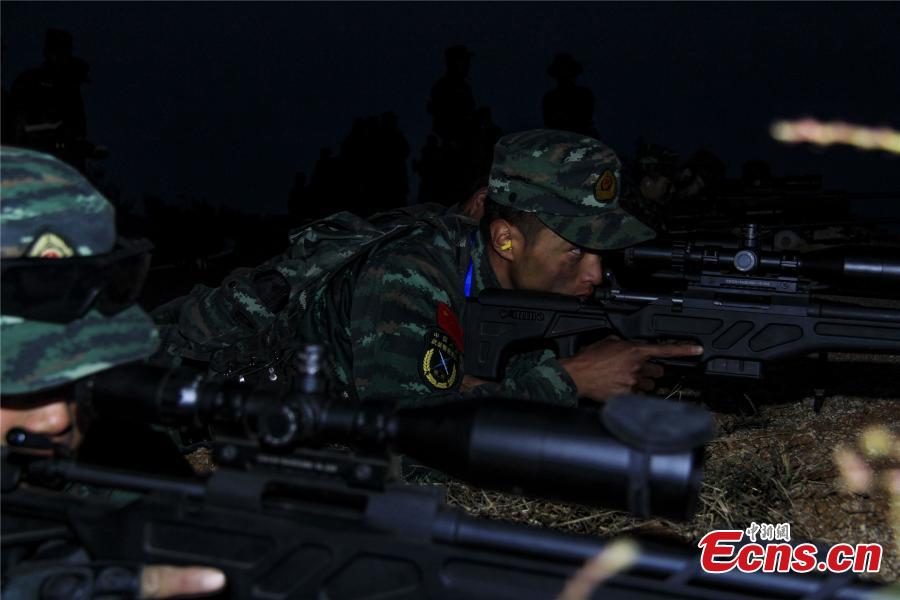 Snipers from a special unit of the Chinese People\'s Armed Police Force sharp their skills during a training at Songshan Mountain, Central China’s Henan province.  (Photo: China News Service/ Zhao Hongtao)
