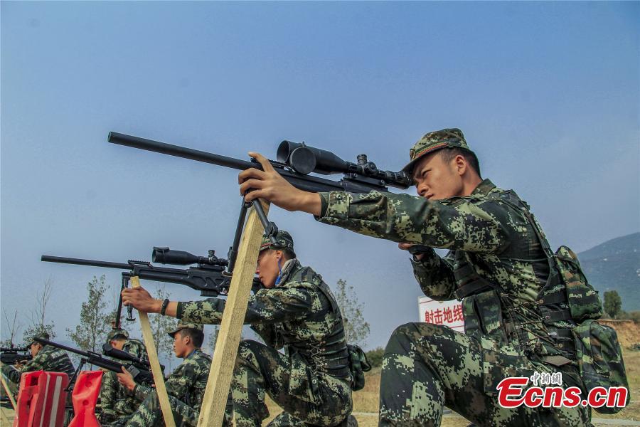 Snipers from a special unit of the Chinese People\'s Armed Police Force sharp their skills during a training at Songshan Mountain, Central China’s Henan province.  (Photo: China News Service/ Zhao Hongtao)