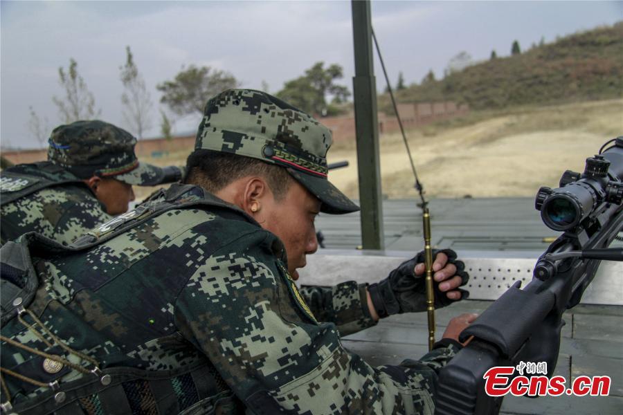 Snipers from a special unit of the Chinese People\'s Armed Police Force sharp their skills during a training at Songshan Mountain, Central China’s Henan province.  (Photo: China News Service/ Zhao Hongtao)