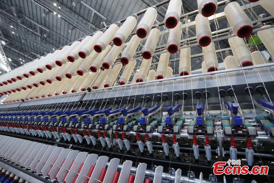 This photo taken on Nov. 2, 2018 shows intelligent and high-end equipment are in place at the exhibition hall of the first China International Import Expo (CIIE). Covering a total exhibition area of 60,000 square meters, it will showcase large and heavy products in the technology-intensive fields of aerospace, robotics and automation. More than 400 enterprises from 40 countries and regions all over the world will participate in this expo. (Photo: China News Service/Zhang Hengwei)