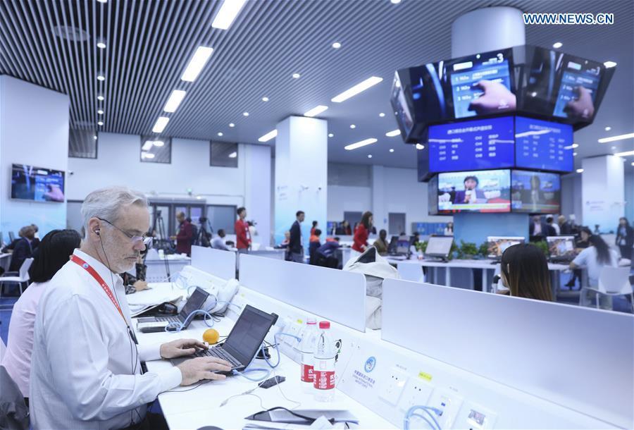 Journalists work at the media center of the first China International Import Expo (CIIE) in Shanghai, east China, Nov. 5, 2018. The first CIIE opened here on Monday and has drawn much attention from domestic and international media. (Xinhua/Lan Hongguang)