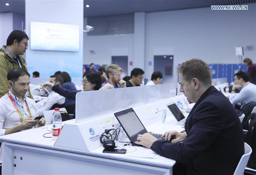 Journalists work at the media center of the first China International Import Expo (CIIE) in Shanghai, east China, Nov. 5, 2018. The first CIIE opened here on Monday and has drawn much attention from domestic and international media. (Xinhua/Lan Hongguang)