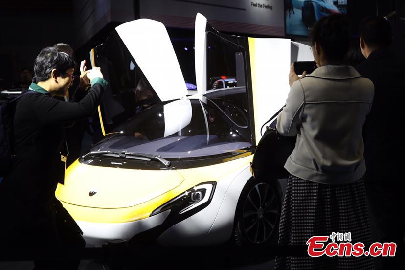 A flying car developed by AeroMobil, a Slovakian advanced engineering company is shown at the China International Import Expo (CIIE) opened in Shanghai on November 5, 2018. Integrating innovation in automotive and aerospace fields, the car with wings applies automotive safety standards together with lightweight materials and advanced aerodynamics. This will provide owners with true freedom of movement in the air and on the ground, providing electric propulsion on the road coupled with a lightweight internal combustion engine to provide propulsion in the air. (Photo: China News Service/ Zhang Hengwei)