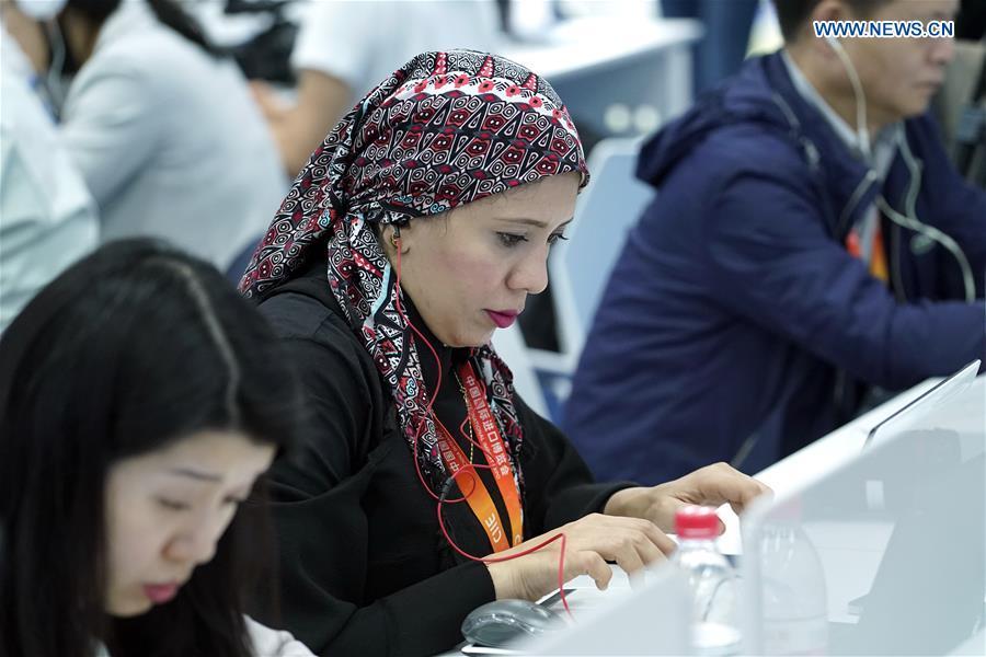 Journalists work at the media center of the first China International Import Expo (CIIE) in Shanghai, east China, Nov. 5, 2018. The first CIIE opened here on Monday and has drawn much attention from domestic and international media.(Xinhua/Shen Bohan)