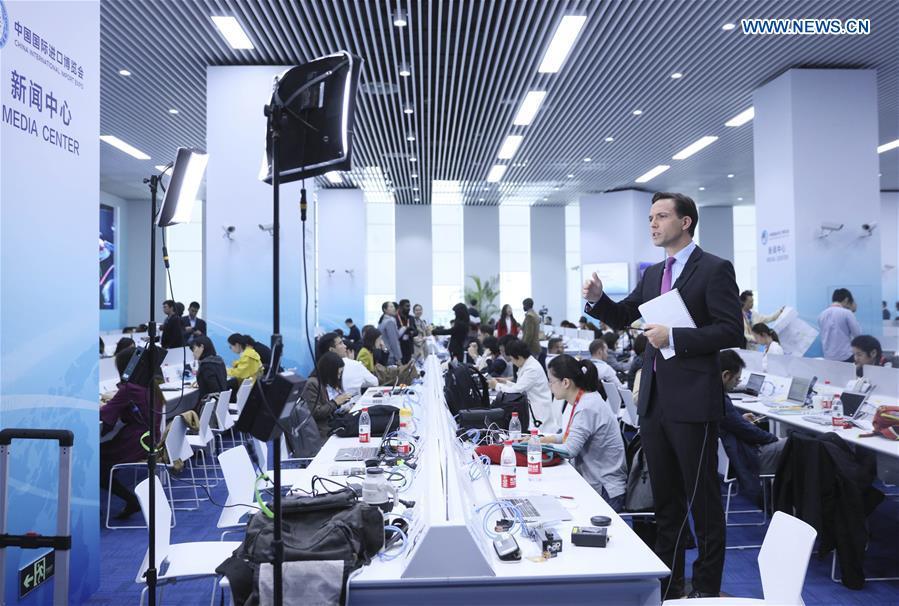 Journalists work at the media center of the first China International Import Expo (CIIE) in Shanghai, east China, Nov. 5, 2018. The first CIIE opened here on Monday and has drawn much attention from domestic and international media. (Xinhua/Lan Hongguang)