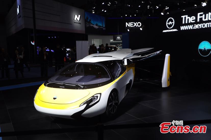 A flying car developed by AeroMobil, a Slovakian advanced engineering company is shown at the China International Import Expo (CIIE) opened in Shanghai on November 5, 2018. Integrating innovation in automotive and aerospace fields, the car with wings applies automotive safety standards together with lightweight materials and advanced aerodynamics. This will provide owners with true freedom of movement in the air and on the ground, providing electric propulsion on the road coupled with a lightweight internal combustion engine to provide propulsion in the air. (Photo: China News Service/ Zhang Hengwei)