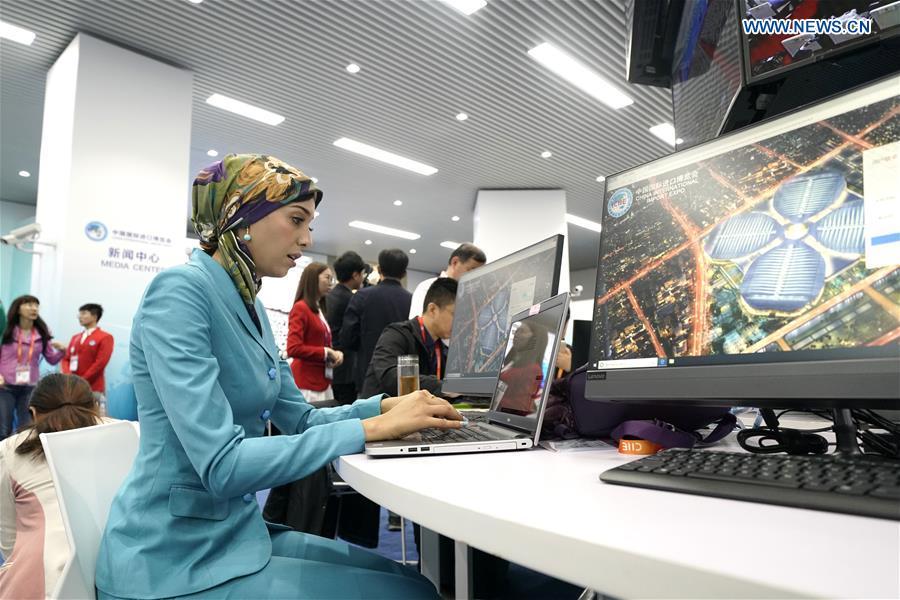 Journalists work at the media center of the first China International Import Expo (CIIE) in Shanghai, east China, Nov. 5, 2018. The first CIIE opened here on Monday and has drawn much attention from domestic and international media. (Xinhua/Shen Bohan)