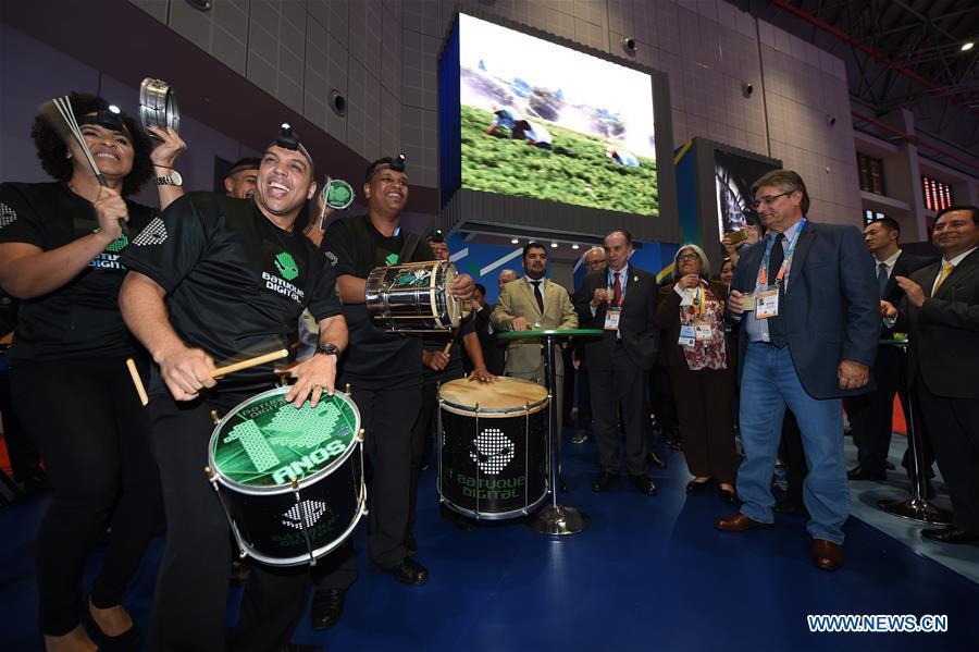 A band from Brazil perform at the Brazil pavilion during the first China International Import Expo (CIIE) in Shanghai, east China, Nov. 5, 2018. A total of 82 countries and three international organizations showcased their achievements in economic and trade development as well as competitive products at 71 booths in the Country Pavilion for Trade and Investment at the CIIE. (Xinhua/Han Yuqing)