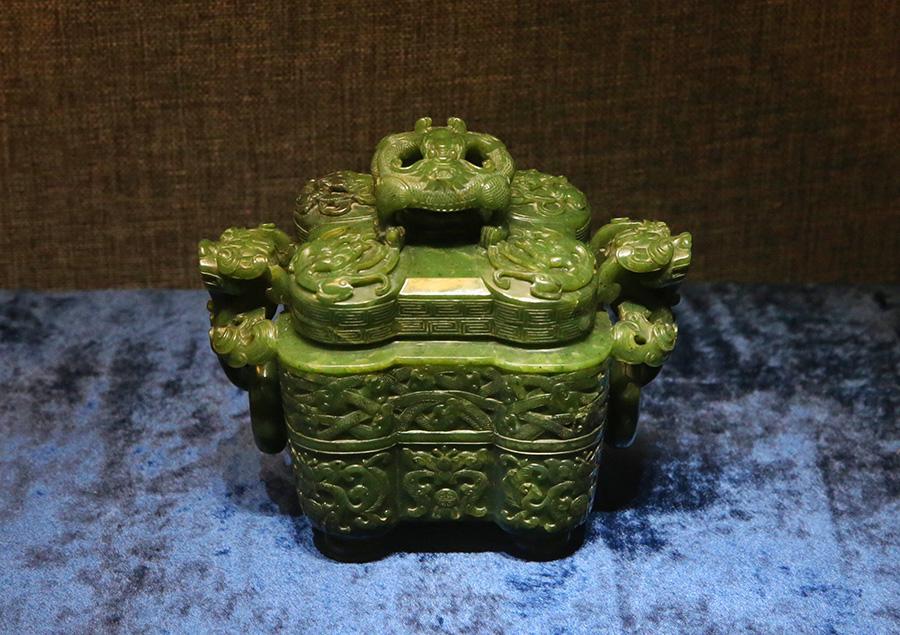 A selection of 93 jades from the holdings of the Summer Palace and the Institute of Qing History of Renmin University are on show at the Summer Palace\'s Dehe Garden through Dec. 8. (Photo/China Daily)