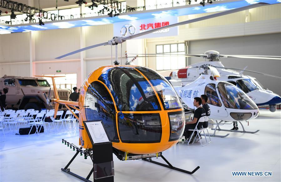 Photo taken on Nov. 5, 2018 shows a civil helicopter at the exhibition area of the upcoming China International Aviation and Aerospace Exhibition in Zhuhai, south China\'s Guangdong Province, Nov. 5, 2018. The exhibition is scheduled to be held on Nov. 6-11. (Xinhua/Deng Hua)