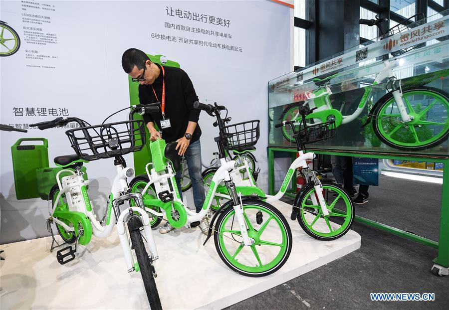 An exhibitor shows an electric bike sharing system at the Light of Internet Expo of the fifth World Internet Conference in Wuzhen Township of Tongxiang, east China\'s Zhejiang Province, Nov. 6, 2018. Opening here on Tuesday, the exposition focuses on the world\'s most recent internet development trends and cutting-edge technologies, showing the latest internet technologies, achievements, products and applications of more than 430 enterprises and institutions from home and abroad. (Xinhua/Xu Yu)
