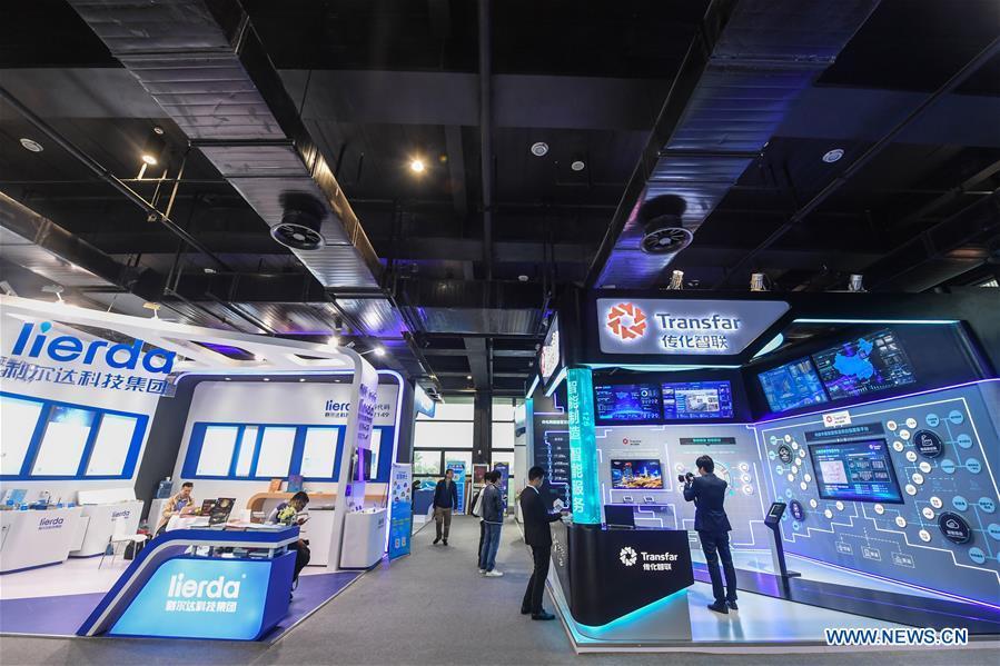 Photo taken on Nov. 6, 2018 shows exhibition booths at the Light of Internet Expo of the fifth World Internet Conference in Wuzhen Township of Tongxiang, east China\'s Zhejiang Province. Opening here on Tuesday, the exposition focuses on the world\'s most recent internet development trends and cutting-edge technologies, showing the latest internet technologies, achievements, products and applications of more than 430 enterprises and institutions from home and abroad. (Xinhua/Xu Yu)