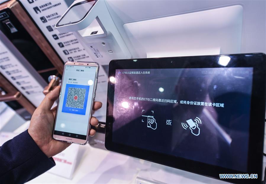 An exhibitor shows an internet-based digital identification system, known as CTID, at the Light of Internet Expo of the fifth World Internet Conference in Wuzhen Township of Tongxiang, east China\'s Zhejiang Province, Nov. 6, 2018. Opening here on Tuesday, the exposition focuses on the world\'s most recent internet development trends and cutting-edge technologies, showing the latest internet technologies, achievements, products and applications of more than 430 enterprises and institutions from home and abroad. (Xinhua/Xu Yu)