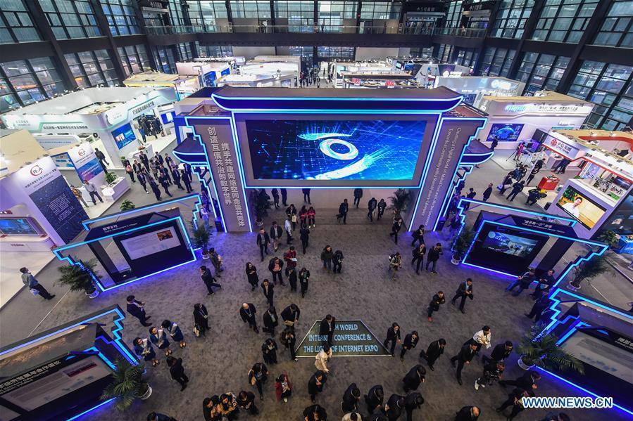 People visit the Light of Internet Expo of the fifth World Internet Conference in Wuzhen Township of Tongxiang, east China\'s Zhejiang Province, Nov. 6, 2018. Opening here on Tuesday, the exposition focuses on the world\'s most recent internet development trends and cutting-edge technologies, showing the latest internet technologies, achievements, products and applications of more than 430 enterprises and institutions from home and abroad. (Xinhua/Xu Yu)