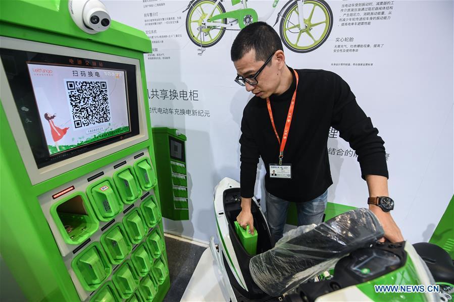 An exhibitor shows an electric bike sharing system at the Light of Internet Expo of the fifth World Internet Conference in Wuzhen Township of Tongxiang, east China\'s Zhejiang Province, Nov. 6, 2018. Opening here on Tuesday, the exposition focuses on the world\'s most recent internet development trends and cutting-edge technologies, showing the latest internet technologies, achievements, products and applications of more than 430 enterprises and institutions from home and abroad. (Xinhua/Xu Yu)
