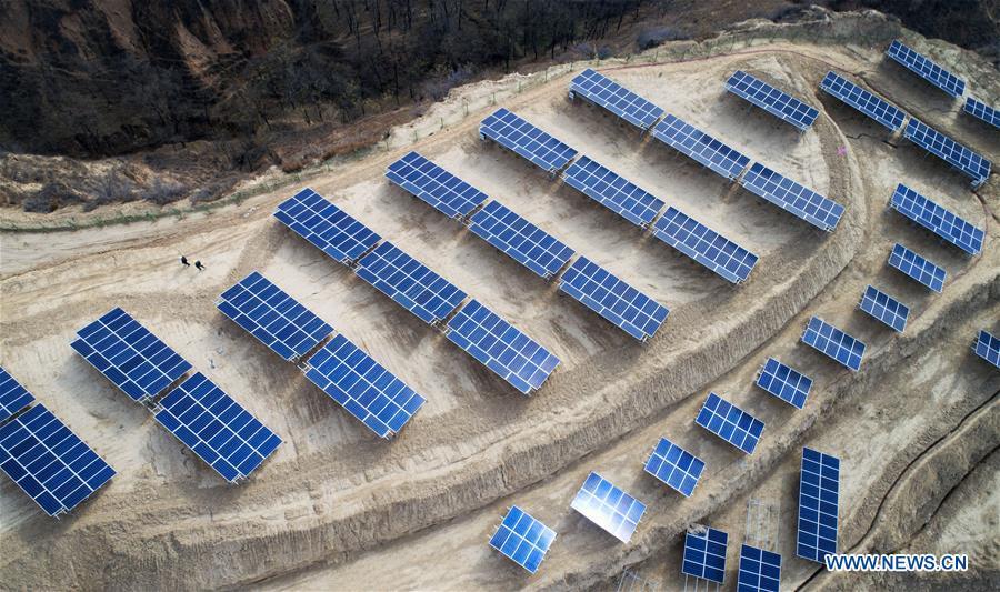 Aerial photo taken on Nov. 7, 2018 shows a photovoltaic power station built under an inter-village poverty relief program in Huojiaping Village of Yihe Township, Suide County, northwest China\'s Shaanxi Province. Located on the Loess Plateau, Suide County has abundant sunshine and idle lands which are ideal for the construction of photovoltaic power stations. Currently, local authorities are working with a provincial branch of electricity service provider State Grid on a 33-megawatt photovoltaic power station. (Xinhua/Liu Xiao)