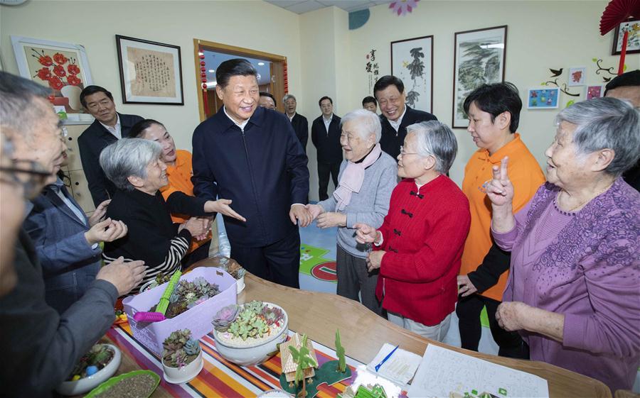 Chinese President Xi Jinping, also general secretary of the Communist Party of China Central Committee and chairman of the Central Military Commission, talks with elderly citizens at a nursery for the elderly of a community center in Hongkou District of east China\'s Shanghai, Nov. 6, 2018. Xi Jinping made a two-day inspection in Shanghai, which ended on Wednesday. (Xinhua/Li Tao)