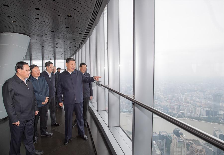 Chinese President Xi Jinping, also general secretary of the Communist Party of China Central Committee and chairman of the Central Military Commission, shakes hands with local residents at a community center in Hongkou District of east China\'s Shanghai, Nov. 6, 2018. Xi Jinping made a two-day inspection in Shanghai, which ended on Wednesday. (Xinhua/Xie Huanchi)