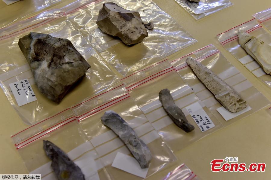 Flints, firing pins, scrapers and other prehistoric items are displayed by archaeologists from INRAP (National Institute of Preventive Archaeological Research) during an excavation of a construction site near the train station of Angouleme, southwest France on November 7, 2018 where important prehistoric discoveries have been made. On this site of some 2,000 square meters, the excavations covers several prehistoric periods starting 11,500 years ago to 8500 years before the Common Era (BCE). (Photo/Agencies)