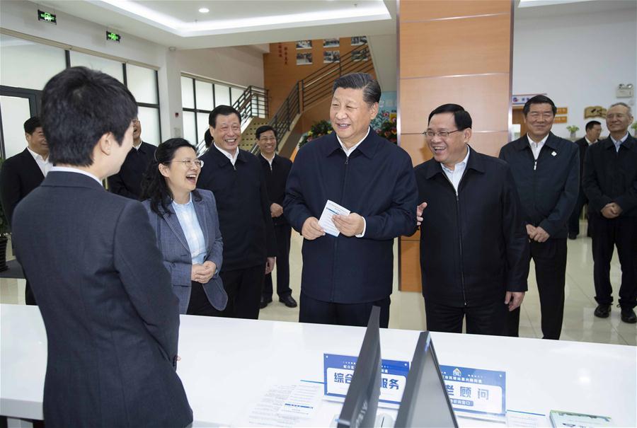Chinese President Xi Jinping, also general secretary of the Communist Party of China Central Committee and chairman of the Central Military Commission, talks with staff members at a community center in Hongkou District of east China\'s Shanghai, Nov. 6, 2018. Xi Jinping made a two-day inspection in Shanghai, which ended on Wednesday. (Xinhua/Li Tao)